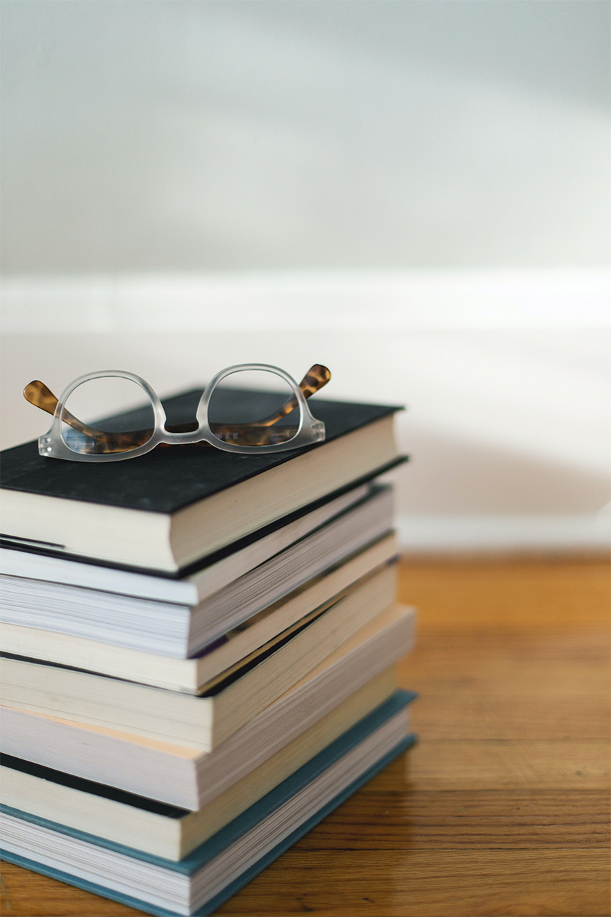 Stack of Books with Reading Glasses