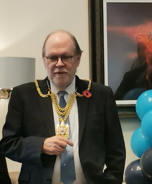 Residents, staff, and guests gathered at Dalgety Bay Care Home’s first birthday celebration, featuring colourful decorations, a ribbon-cutting ceremony, and live bagpipe music.