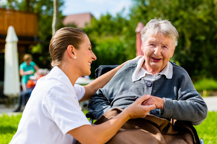 carer interacting with resident in a wheelchair