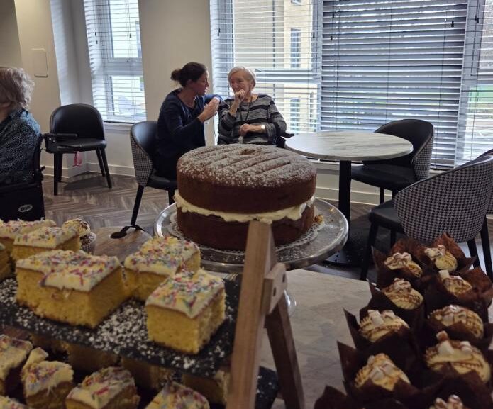 residents at the memory cafe with tea and cake