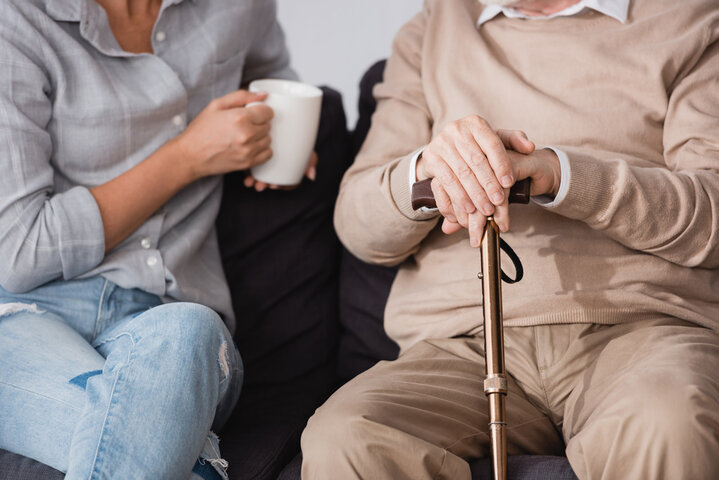 old man talking to adult daughter about care homes