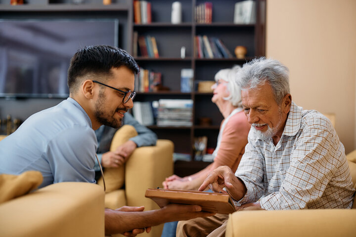 nurse and resident in lounge